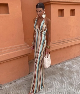 Detail of colorful wavy crochet knit pattern and deep V-neck on the long dress