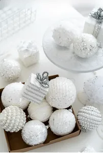 Detail of white foam Christmas ornaments with sequins, pearls and silver gift box accents