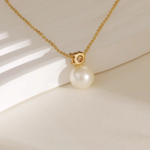 Elegant gold snake chain necklace with a single round white pearl pendant for daily wear