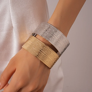 Exotic vintage wide open cuff bracelet with intricate floral relief in gold and silver