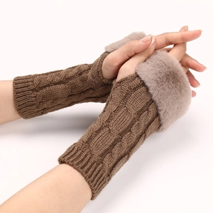 Detail of brown cable knit arm warmers featuring soft faux fur trim for winter