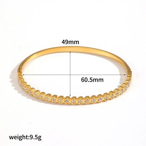 Macro view of 18k gold plated stainless steel bracelet with diamond inlay and size specs