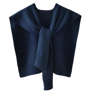 Detail of navy blue core-spun yarn knitted shawl with elegant front tie closure