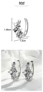 Detail of silver C-shape ear cuff with 3mm and 5mm blank claw settings for DIY jewelry