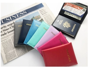 Fanned display of colorful PU leather passport covers showing various travel organizers