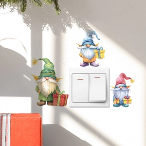 Festive cartoon Christmas gnome wall stickers applied around a white home light switch