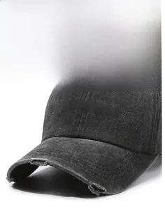 Close-up of distressed brim and white FRAGRANCE embroidery on washed cotton baseball cap
