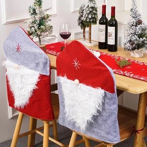 Red and grey Santa hat chair covers with gnome beard and star embroidery for dining decor