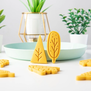 Set of creative yellow Christmas tree cookie molds for festive DIY baking and pastry crafts