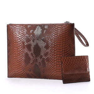 Detailed view of a brown python texture PU leather envelope clutch with matching card holder
