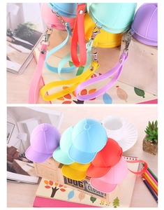 Detailed close-up of vibrant silicone baseball cap coin purses with secure zipper and strap