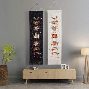 Bohemian tapestry set featuring floral and moon phase patterns with tassels and rods