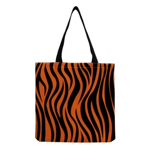 Large orange zebra print tote bag with black fabric shoulder straps for women