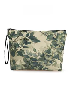 Detailed view of vintage green leaf pattern on a linen canvas makeup bag with zipper