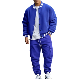 Detail of blue men's baseball jacket and cargo pants tracksuit with striped ribbed cuffs