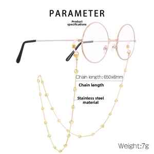 Detail of stainless steel golden eyeglass chain with heart decorative charms and dimensions