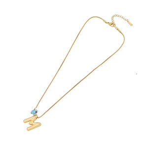 Gold evil eye necklace with letter M pendant made of stainless steel for women