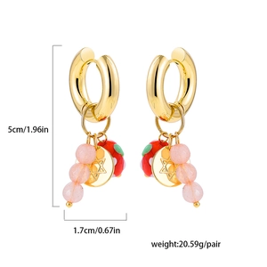 Detail of gold hoop earrings with red fruit pendants and size dimensions in inches