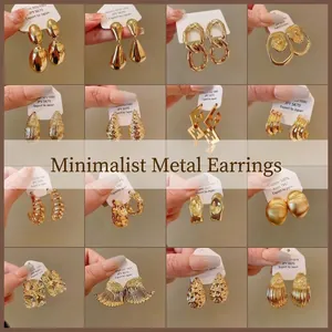 Collection of geometric gold minimalist earrings featuring 925 silver needles and copper