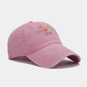 Pink washed cotton baseball cap with embroidered lettering for a vintage retro look