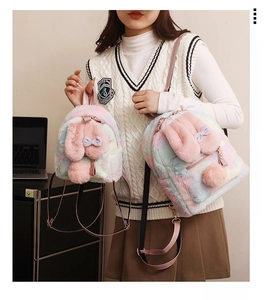 Detail of plush rainbow rabbit backpack with soft faux fur ears and colorful gradient texture
