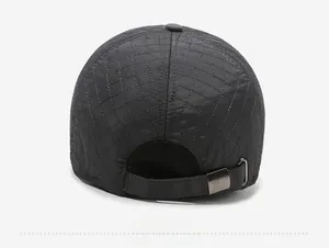 Detail view of the quilted baseball cap back with an adjustable metal buckle