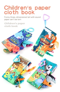 Detail showing sensory baby cloth books with 3D animal tails and hanging rings