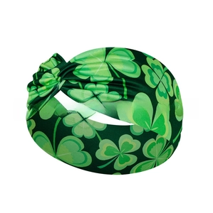 Detail of green Saint Patrick's Day headband featuring clover pattern and twisted knot