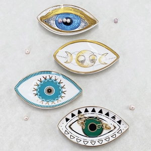 Set of four ceramic Evil Eye jewelry trays with moon phases and geometric patterns