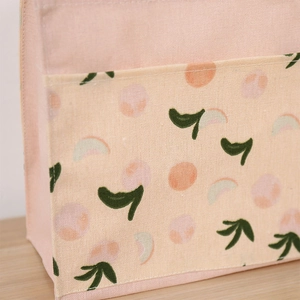Pink canvas tote bag with peach pocket detail for students and daily minimalist use
