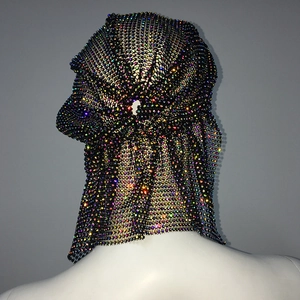 Detail showing AB rhinestone mesh headpiece with long sparkling draped tail