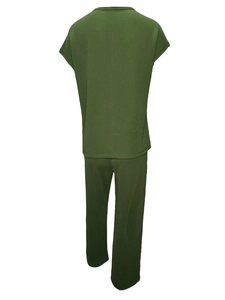 Detail of olive green two-piece lounge set with vertical pleated texture and wide-leg trousers
