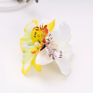 Detailed close-up of double orchid hair clip featuring yellow, orange, and white faux silk flowers