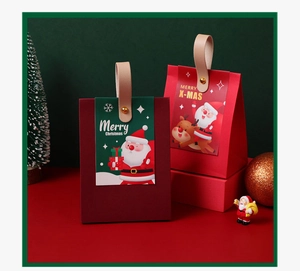 Detail of Christmas gift box featuring a premium leather handle and Santa Claus card insert