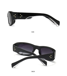 Side and back view of black thick frame sunglasses with gold star rivets and gradient lenses