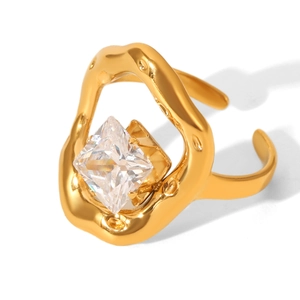 Macro view of gold lava texture ring with a sparkling square cubic zirconia stone