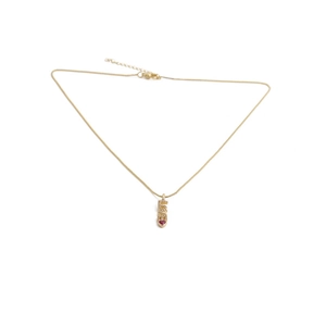 Gold lipstick pendant necklace with a red heart gem and crystal accents on a box chain