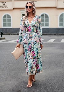 Detail of V-neck printed long sleeve dress with high waist and flowy hemline