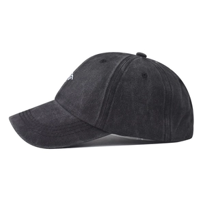 Detail view of washed grey cotton denim baseball cap with white letter embroidery
