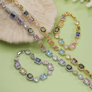 Detail of colorful geometric gemstone bracelets and necklaces in gold and silver plating