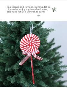 Macro view of red and white striped lollipop Christmas ornament with soft fabric texture