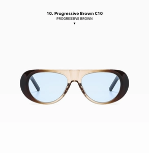 Detail of trendy oval sunglasses with progressive brown frames and light blue lenses