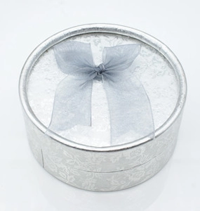 Silver textured jewelry gift box with a grey tulle bow for heart ring and earring sets