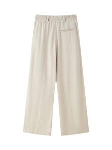 Detailed back view of beige wide-leg suit pants featuring elastic waist and welt pocket