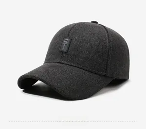 Detailed macro view of dark grey wool texture and Down the street embroidery on cap