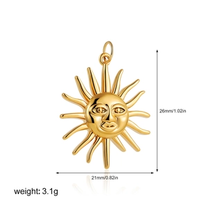 Macro shot of 18K gold sun pendant detailing 26mm x 21mm size and 3.1g weight on white