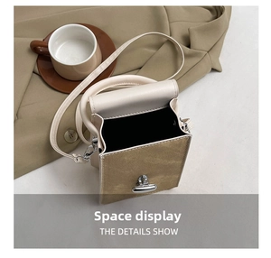 Detail showing the internal storage space of the beige PU leather crossbody bag