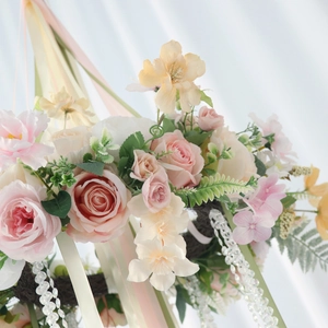 Floral hanging garland with pink and champagne roses, ribbons and beads for parties