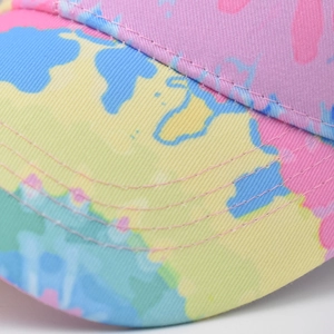 Macro detail of twill cotton baseball cap with gradient world map print and reinforced stitching