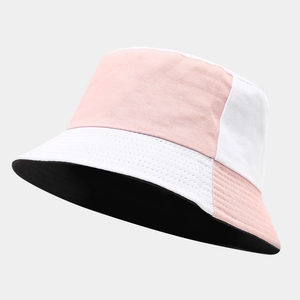Detail of two-tone pink and white fisherman hat with stitching on cotton fabric